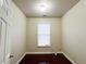 Neutral bedroom features hardwood floors and a window that brings in plenty of natural light at 4978 Arborview Pkwy, Acworth, GA 30101