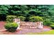 Stone bench in a serene common area with lush landscaping. Relax and enjoy the outdoors! at 4978 Arborview Pkwy, Acworth, GA 30101