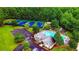Aerial view showcasing community amenities including tennis courts, clubhouse, pool, and playground at 4978 Arborview Pkwy, Acworth, GA 30101