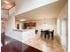 Bright dining room featuring tile floors, modern lighting, and a door to the exterior at 4978 Arborview Pkwy, Acworth, GA 30101