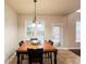 Dining room featuring a wood table, black chairs, and natural light at 4978 Arborview Pkwy, Acworth, GA 30101