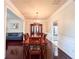 Formal dining room with hardwood floors, chandelier, and built-in china cabinet at 4978 Arborview Pkwy, Acworth, GA 30101