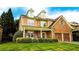 Beautiful two-story home with well-manicured front lawn and landscaped garden beds at 4978 Arborview Pkwy, Acworth, GA 30101