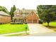 Charming two-story home features a well-manicured lawn, two-car garage, and inviting front porch at 4978 Arborview Pkwy, Acworth, GA 30101