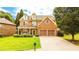 Beautiful two-story home featuring a blend of brick and stone, a cozy front porch, and an attached two-car garage at 4978 Arborview Pkwy, Acworth, GA 30101
