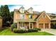 Two-story home boasts a brick and siding exterior, plus a well-manicured front lawn at 4978 Arborview Pkwy, Acworth, GA 30101