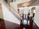 Bright foyer with hardwood floors, staircase, and a view of the front door, showcasing the home's entry at 4978 Arborview Pkwy, Acworth, GA 30101