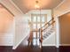 Bright foyer with hardwood floors, staircase, and natural light from large windows at 4978 Arborview Pkwy, Acworth, GA 30101