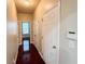 Hallway with hardwood floors and neutral walls at 4978 Arborview Pkwy, Acworth, GA 30101