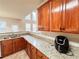 Stylish kitchen with stone counters, stainless dishwasher, and wooden cabinets at 4978 Arborview Pkwy, Acworth, GA 30101