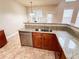 Kitchen featuring granite countertops, wood cabinets, and stainless steel dishwasher at 4978 Arborview Pkwy, Acworth, GA 30101