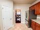 View of the modern kitchen leading to the dining area with stainless steel refrigerator at 4978 Arborview Pkwy, Acworth, GA 30101