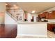 Kitchen with breakfast bar, stainless steel appliances, granite countertops, tile backsplash, and tile floors at 4978 Arborview Pkwy, Acworth, GA 30101