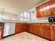 Bright kitchen with stone counters, stainless dishwasher, and wooden cabinets at 4978 Arborview Pkwy, Acworth, GA 30101