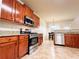 Well-lit kitchen featuring stainless steel appliances, granite countertops, and wood cabinets at 4978 Arborview Pkwy, Acworth, GA 30101