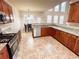Open kitchen with granite countertops, stainless appliances, and natural light at 4978 Arborview Pkwy, Acworth, GA 30101