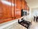 Close-up of the kitchen, featuring granite countertops, stainless steel appliances, and wood cabinets at 4978 Arborview Pkwy, Acworth, GA 30101