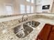 Gourmet kitchen featuring a stainless steel sink, granite countertops, and a stylish faucet at 4978 Arborview Pkwy, Acworth, GA 30101