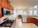 Kitchen featuring stainless appliances, granite counters, wood cabinets and tile flooring at 4978 Arborview Pkwy, Acworth, GA 30101