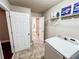 Laundry room offers shelving, washer, and access to other rooms at 4978 Arborview Pkwy, Acworth, GA 30101