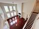 Spacious living room with dark hardwood floors and a fireplace, bathed in natural light at 4978 Arborview Pkwy, Acworth, GA 30101