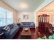 Comfortable living room boasts hardwood floors, a large window, and stylish furnishings, perfect for relaxation and gatherings at 4978 Arborview Pkwy, Acworth, GA 30101