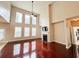Bright living room with a fireplace, ceiling fan, and lots of natural light from the many windows at 4978 Arborview Pkwy, Acworth, GA 30101