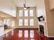 Bright living room with hardwood floors, high ceilings, fireplace, and large windows at 4978 Arborview Pkwy, Acworth, GA 30101