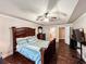 This main bedroom features tray ceilings, dark furniture, and ensuite bathroom access at 4978 Arborview Pkwy, Acworth, GA 30101