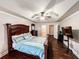 Spacious main bedroom featuring tray ceilings, dark furniture, and ensuite bathroom access at 4978 Arborview Pkwy, Acworth, GA 30101