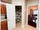 Walk-in pantry with organized shelving, adjacent to kitchen at 4978 Arborview Pkwy, Acworth, GA 30101
