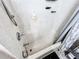 Bright shower with speckled tile, built in seat, and chrome shower head fixture at 4978 Arborview Pkwy, Acworth, GA 30101