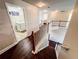 View from the staircase landing, showcasing hardwood floors and nearby laundry room at 4978 Arborview Pkwy, Acworth, GA 30101