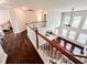 Hardwood floors in the upstairs hallway, overlooking the living room below at 4978 Arborview Pkwy, Acworth, GA 30101