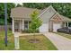 Charming single-story home with a well-maintained front yard, covered porch, and attached one car garage at 560 Vandenburg Dr, Villa Rica, GA 30180