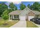 Charming single-story home with a well-maintained front yard, covered porch, and attached one car garage at 560 Vandenburg Dr, Villa Rica, GA 30180