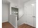 Hallway with a stylish light fixture and a closet with double doors at 560 Vandenburg Dr, Villa Rica, GA 30180