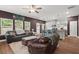 Open-concept living room and kitchen area, with comfortable seating and modern finishes at 560 Vandenburg Dr, Villa Rica, GA 30180