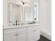 Bright bathroom features a double vanity, sleek mirrors, and modern fixtures at 100 5Th St, Fayetteville, GA 30214