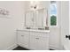 Bright bathroom features a double vanity, sleek mirrors, and modern fixtures at 100 5Th St, Fayetteville, GA 30214