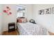 Charming bedroom featuring hardwood floors, stylish decor, and natural light at 100 5Th St, Fayetteville, GA 30214
