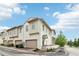 Exterior of townhome with garage, manicured lawn, and landscaped yard providing curb appeal at 100 5Th St, Fayetteville, GA 30214