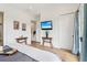 Comfortable main bedroom with hardwood floors, sitting area, and a modern TV at 100 5Th St, Fayetteville, GA 30214