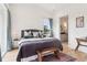 Bright main bedroom with hardwood floors, sitting area, and large windows at 100 5Th St, Fayetteville, GA 30214