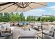 Wide shot of patio with comfortable seating, hammock and scenic views create an inviting outdoor space at 100 5Th St, Fayetteville, GA 30214