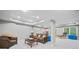 Finished basement with recessed lighting and comfortable seating area at 1335 Joy Ct, Suwanee, GA 30024