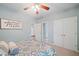 Relaxing bedroom includes a ceiling fan, ample storage, and convenient access to other rooms at 1335 Joy Ct, Suwanee, GA 30024