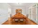 Elegant dining room features hardwood floors, and a beautiful china cabinet, perfect for entertaining at 1335 Joy Ct, Suwanee, GA 30024
