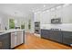 Gourmet kitchen with stainless steel appliances, quartz countertops, and custom cabinetry at 1335 Joy Ct, Suwanee, GA 30024