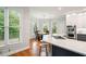 Modern kitchen with quartz countertops, stainless steel appliances, and an adjacent dining area at 1335 Joy Ct, Suwanee, GA 30024